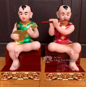 Tượng Cậu ngồi đàn ca sáo nhị